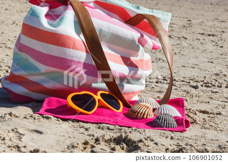 Accessories for relax or sunbathing on beach. Travel and vacation time Accessories for relax or sunbathing on beach. Travel and vacation time 106901052