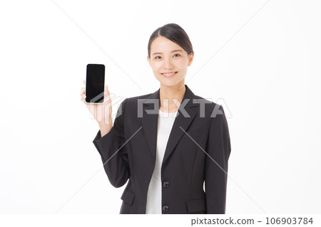 A woman with a suit with a smartphone 106903784