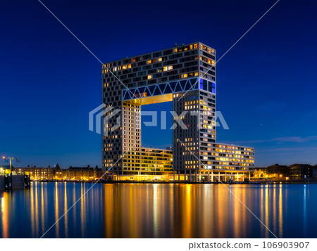 Amsterdam, Netherlands. A cityscape in the evening. A skyscraper and business center 106903907