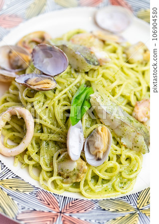 Genovese pasta with plenty of seafood Genovese pasta with plenty of seafood 106904580