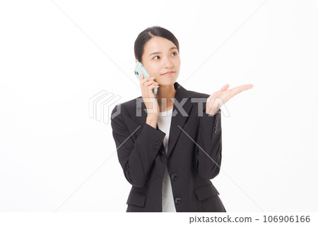 A woman with a suit with a smartphone 106906166