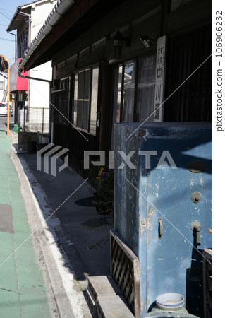 Old company building and retro safe along the road 106906232