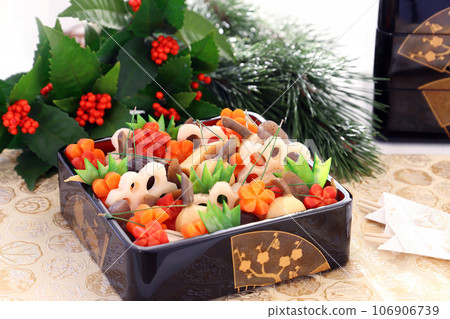 Handmade simmered rice dishes served in a box. Osechi cuisine Handmade simmered rice dishes served in a box. Osechi cuisine 106906739