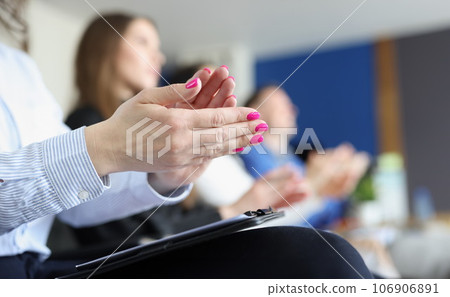 Business people clap their hands and applaud at meeting or conference Business people clap their hands and applaud at meeting or conference 106906891