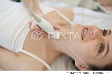 Professional screening doctor performs examination of thyroid gland 106906906