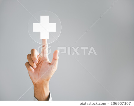 Businessman hand taps a virtual plus sign, representing positivity. Conveys ideas of increased benefits, progressive thinking, and a positive mindset. Business and success concept. positive thing 106907307