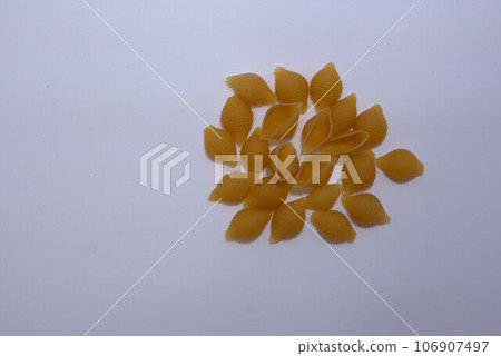 Dried pasta conchiglie material 106907497