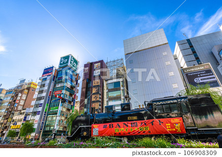Tokyo cityscape in Japan - view of Shinbashi SL plaza in front of Shinbashi station and bar district 106908309