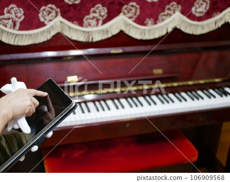 My parents' old upright piano 106909568
