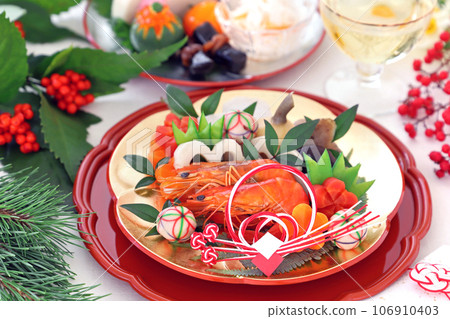 A gorgeous osechi dish for one person, served on a gold and silver plum plate.A osechi dish for one person. A gorgeous osechi dish for one person, served on a gold and silver plum plate.A osechi dish for one person. 106910403