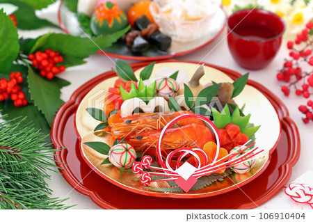 A gorgeous osechi dish for one person, served on a gold and silver plum plate.A osechi dish for one person. 106910404