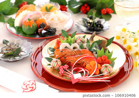 A gorgeous osechi dish for one person, served on a gold and silver plum plate.A osechi dish for one person. A gorgeous osechi dish for one person, served on a gold and silver plum plate.A osechi dish for one person. 106910406