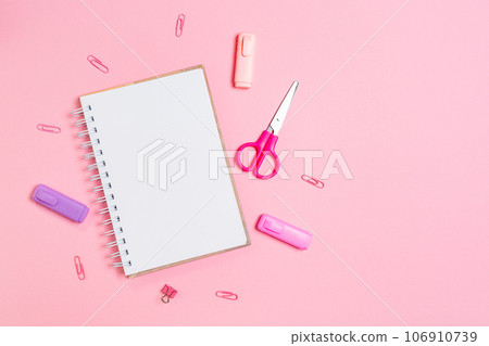 Back to school. Composition with copybook and pink office supplies on pink background. Flat lay. Mock up. Concept of education and creativity 106910739