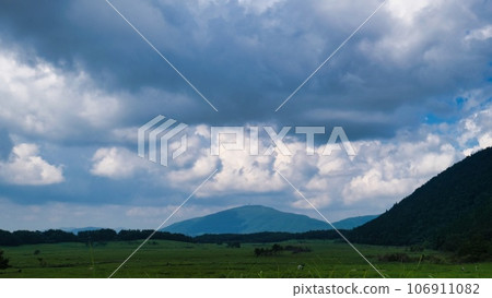 A photo of rain clouds surrounding a mountain A photo of rain clouds surrounding a mountain 106911082