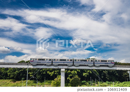 Monorail heading towards Banpaku Kinen Koen Station on the Saito Line Monorail heading towards Banpaku Kinen Koen Station on the Saito Line 106911409