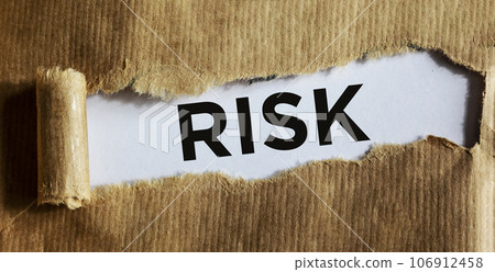 Word RISK on torn paper - business and financial concepts Word RISK on torn paper - business and financial concepts 106912458