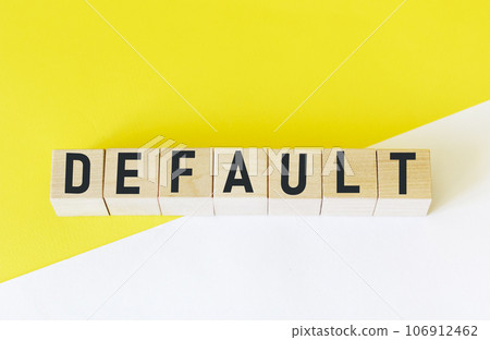 word DEFAULT on wooden cubes and yellow and white background 106912462