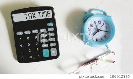 Tax Time word on calculator. Business and tax concept. Time to pay tax in year. 106912585
