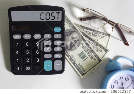 Calculator with the word cost on the display, next to dollars 106912597