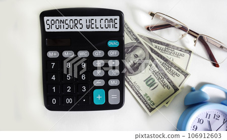 SPONSORS WELCOME text on calculator display with dollar banknotes, glasses and watch SPONSORS WELCOME text on calculator display with dollar banknotes, glasses and watch 106912603
