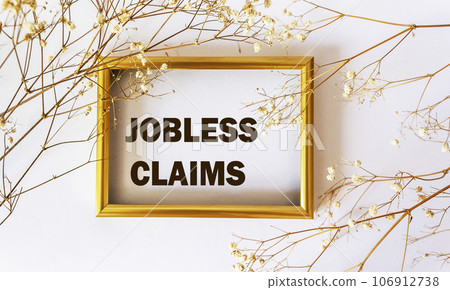 Jobless claims, text drawn on a photo frame with a white 106912738