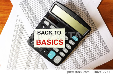 The phrase BACK TO BASICS on the sticker on the calculator and on documents with numbers The phrase BACK TO BASICS on the sticker on the calculator and on documents with numbers 106912745