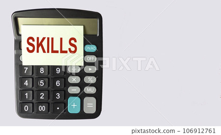 Skills written on a sticker on the calculator. Space for writing, white background 106912761