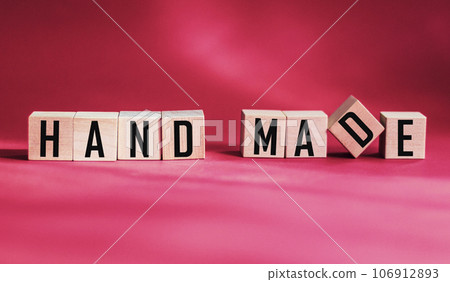 Handmade, motivational phrase on wooden cubes with red background Handmade, motivational phrase on wooden cubes with red background 106912893