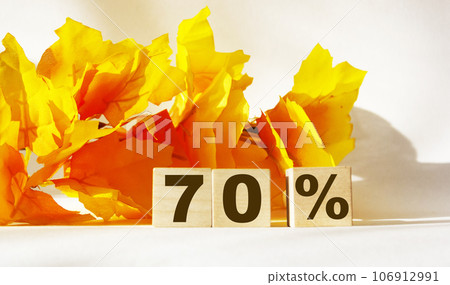 Text 70 percent on wooden cubes for sales, business concept. Text 70 percent on wooden cubes for sales, business concept. 106912991