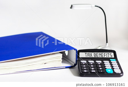 TAX benefits word on calculator. Business and tax concept. Time to pay tax in year. 106913161