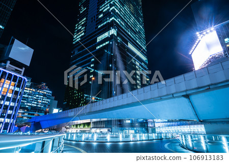 Cyberpunk night view of Shibuya Shibuya Station east exit pedestrian bridge and skyscrapers Cyberpunk night view of Shibuya Shibuya Station east exit pedestrian bridge and skyscrapers 106913183