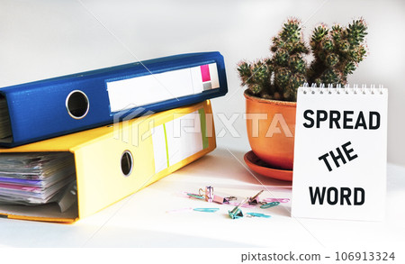 Text Spread the word. Business concept for start up advertising written on a notebook Text Spread the word. Business concept for start up advertising written on a notebook 106913324