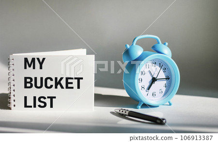 Inspirational and conceptual - My wish list written on notepad and white background. 106913387