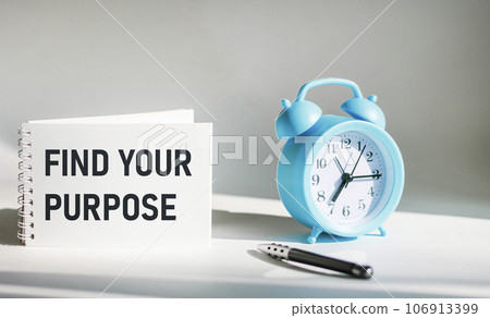 Text message Find your goal on notepad with alarm clock and pen Text message Find your goal on notepad with alarm clock and pen 106913399