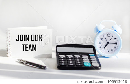 Join our team text on notepad and white background with calculator and clock 106913428