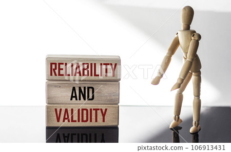 Sign with the inscription Reliability and validity on wooden blocks  106913431