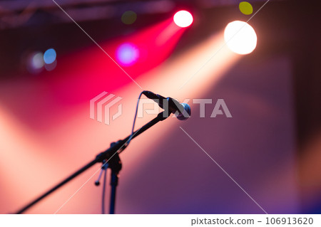 A mic on the stage in spot lights A mic on the stage in spot lights 106913620
