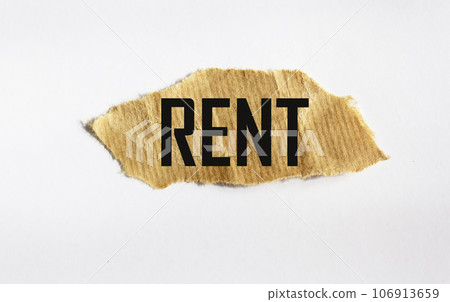 Rent increase symbol written on a scrap of paper and light background Rent increase symbol written on a scrap of paper and light background 106913659