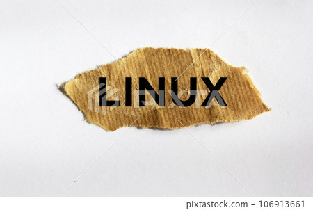 Linux. text on brown torn paper isolated on white background. Linux. text on brown torn paper isolated on white background. 106913661
