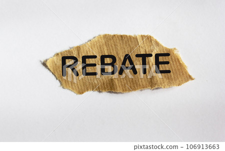 REBATE concept, on brown scrap paper and white background REBATE concept, on brown scrap paper and white background 106913663