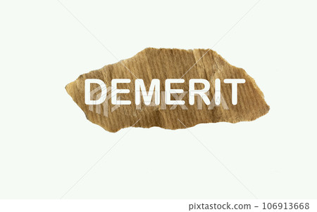Symbol of deficiency. Concept word Demerit on a piece of paper. Beautiful white background, Symbol of deficiency. Concept word Demerit on a piece of paper. Beautiful white background, 106913668