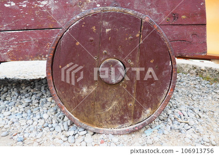 Medieval wooden wheel from a cast-iron cannon. Herceg Novi, Montenegro. Naval artillery, artillery gun. Ancient chariot wheels and cannons made of wood 106913756