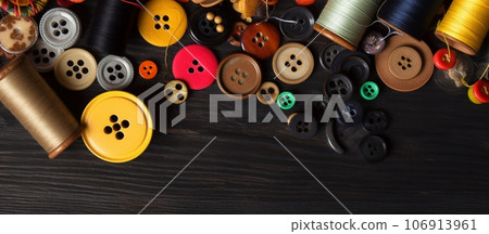 Banner with spools of sewing thread and buttons. Background with sewing accessories. Generative AI. Banner with spools of sewing thread and buttons. Background with sewing accessories. Generative AI. 106913961