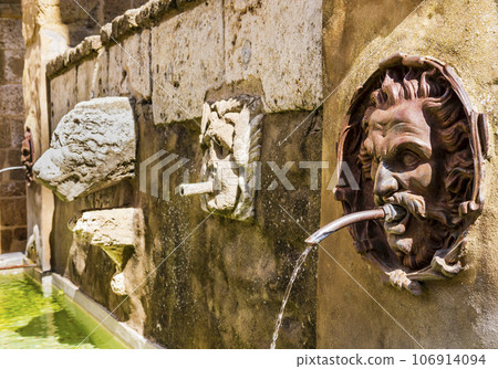 Stunning detail of the Fountain of the Seven Spouts, Pitigliano historical center, Tuscany, Italy Stunning detail of the Fountain of the Seven Spouts, Pitigliano historical center, Tuscany, Italy 106914094