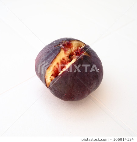 Fig or fig tree, or common fig tree, or Ficus carica is a subtropical deciduous plant of the genus Ficus of the Mulberry family. Ripe purple fig fruits on a light background. Healthy food. Fig or fig tree, or common fig tree, or Ficus carica is a subtropical deciduous plant of the genus Ficus of the Mulberry family. Ripe purple fig fruits on a light background. Healthy food. 106914154