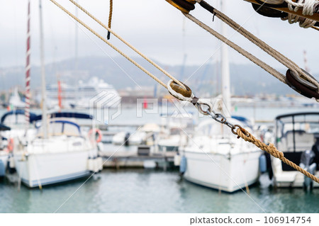 Details of fishing boat docked at harbor. Leisure activity, sport and recreation, traditional craft, environmental damage concepts. 106914754