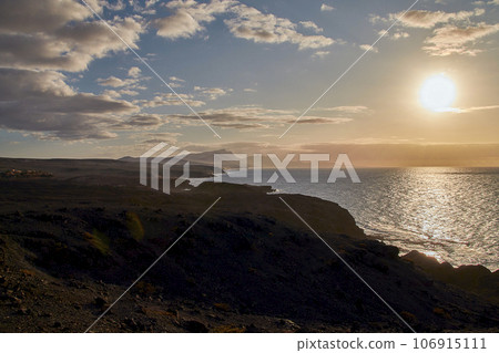 Evening atmosphere on the coast just before sunset near La Pared, Fuerteventura, Canary Islands, Spain Evening atmosphere on the coast just before sunset near La Pared, Fuerteventura, Canary Islands, Spain 106915111