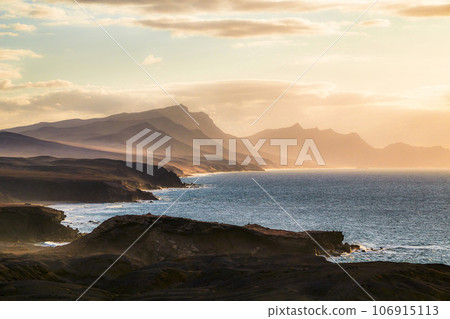 The west coast of Fuerteventura in the evening light from the village of La Pared, Canary Islands, Spain The west coast of Fuerteventura in the evening light from the village of La Pared, Canary Islands, Spain 106915113