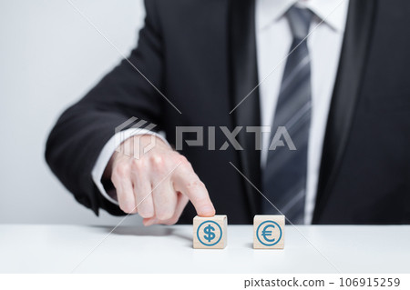 Wooden blocks with currency icons Wooden blocks with currency icons 106915259