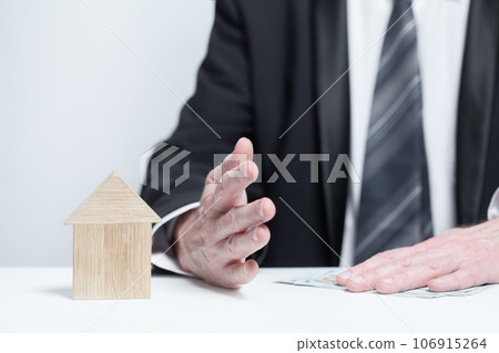 Wooden house under protection, insurance safety property concept Wooden house under protection, insurance safety property concept 106915264